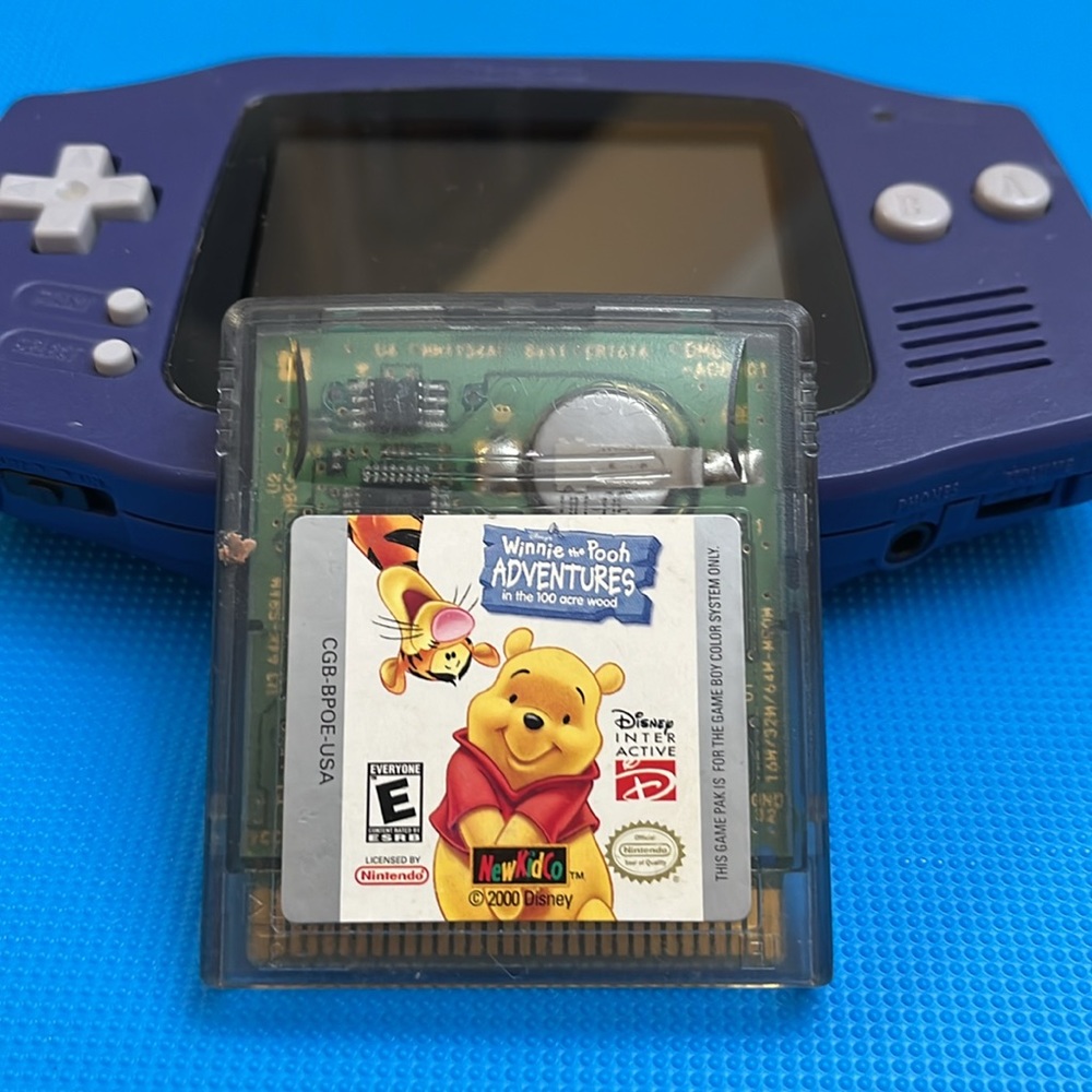 GAME BOY ADVANCE.  PURPLE. BATTERY COVER MISSING.  POOH GAME included